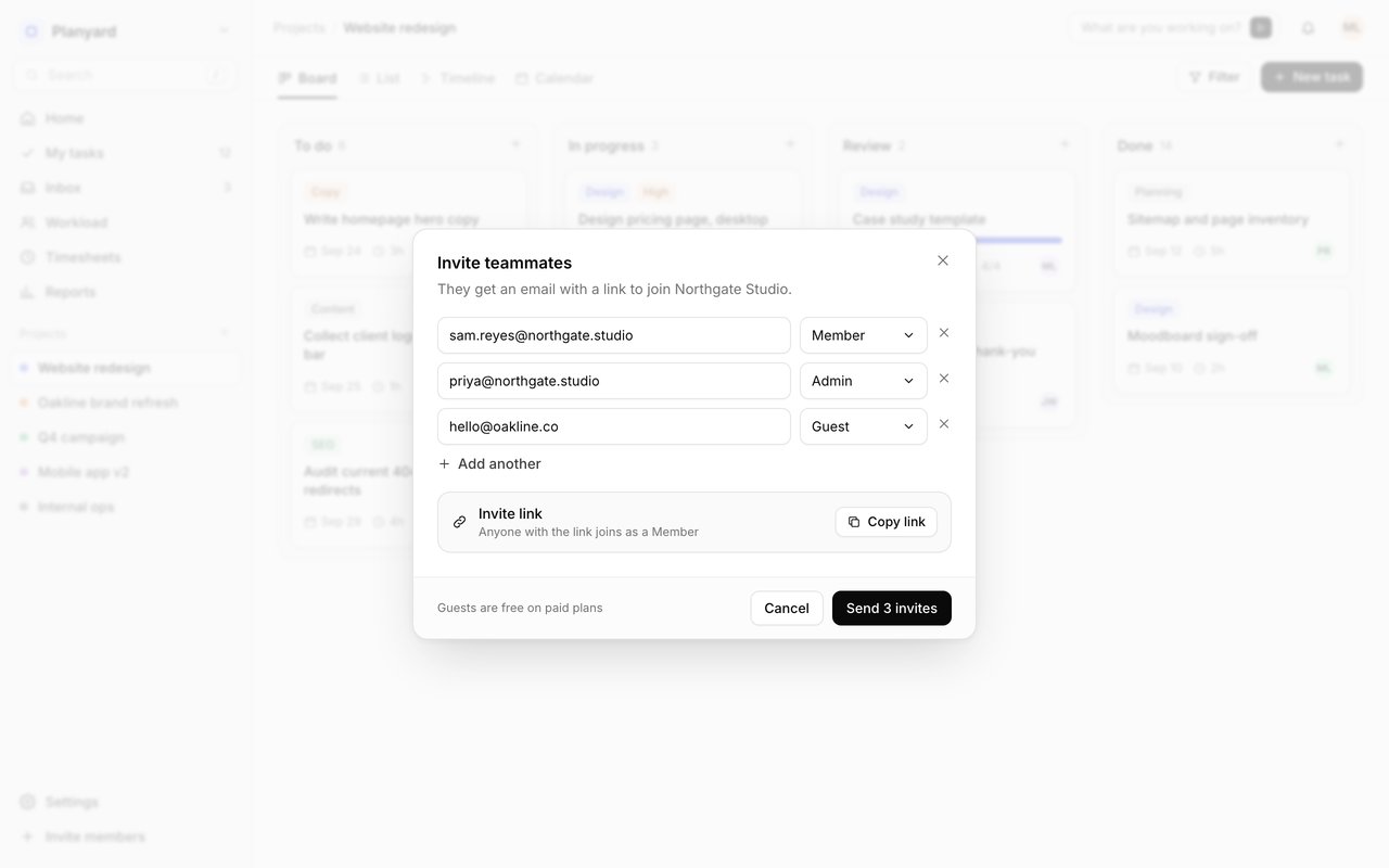 Invite dialog with three email addresses and a role menu