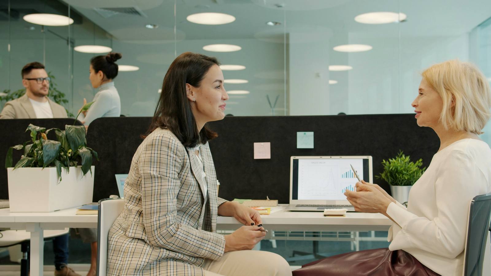 Two advisers at a desk