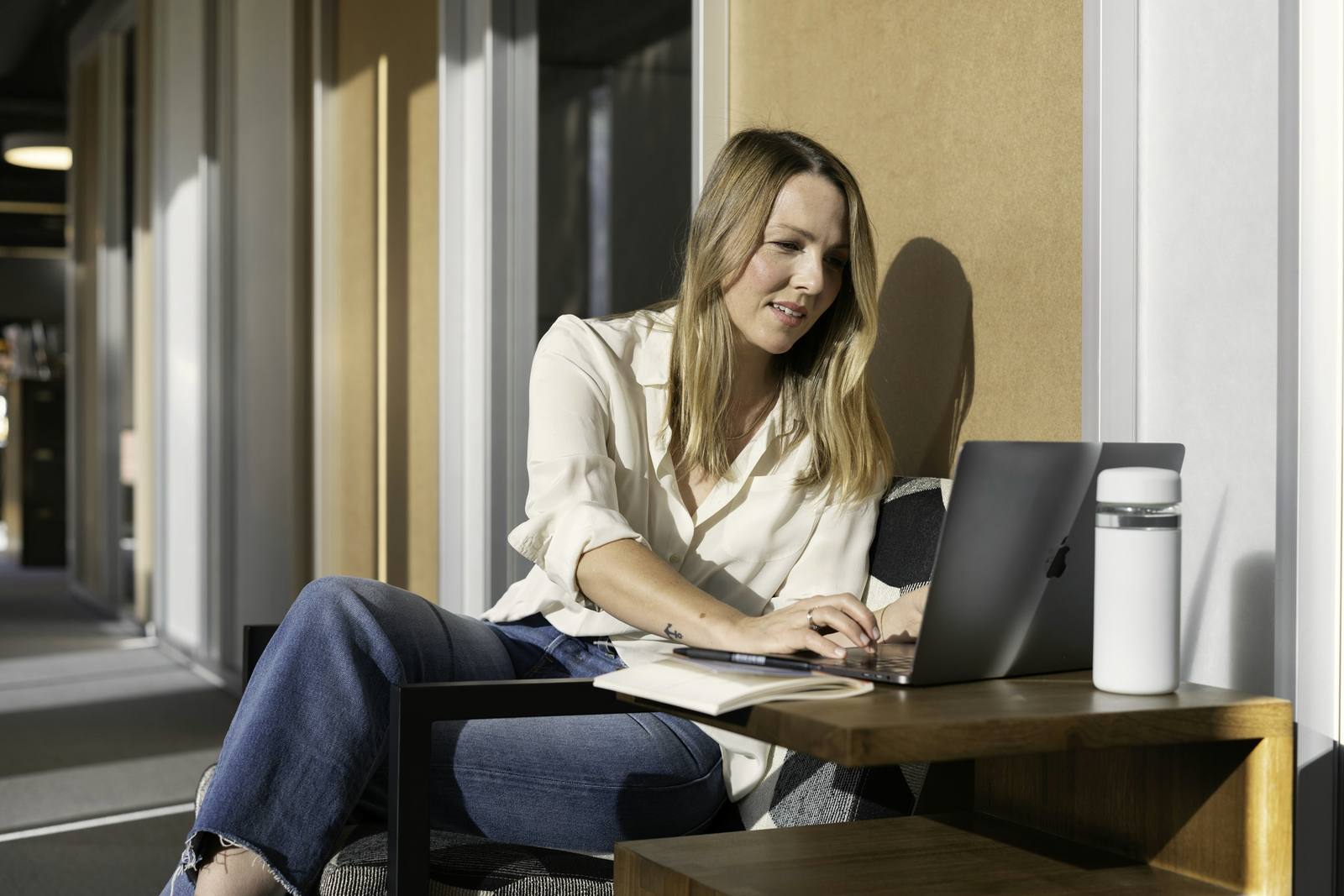 A client working at a window desk