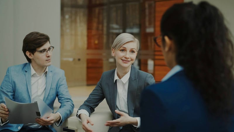 Three colleagues in a bright meeting