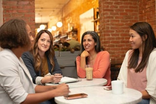 A team meeting around a café-style table