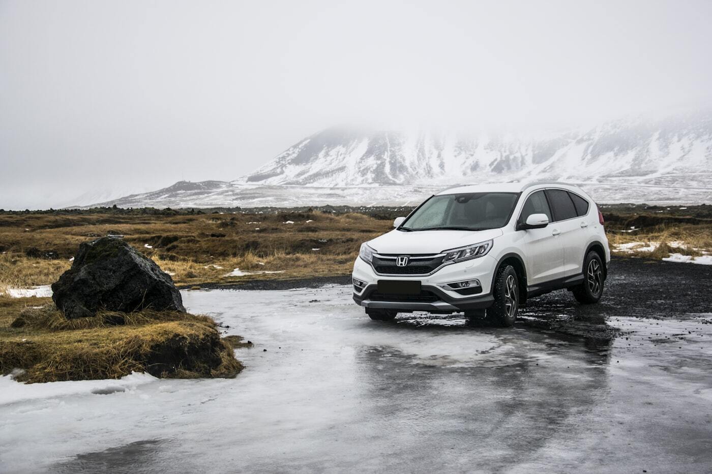 White SUV on a mountain road