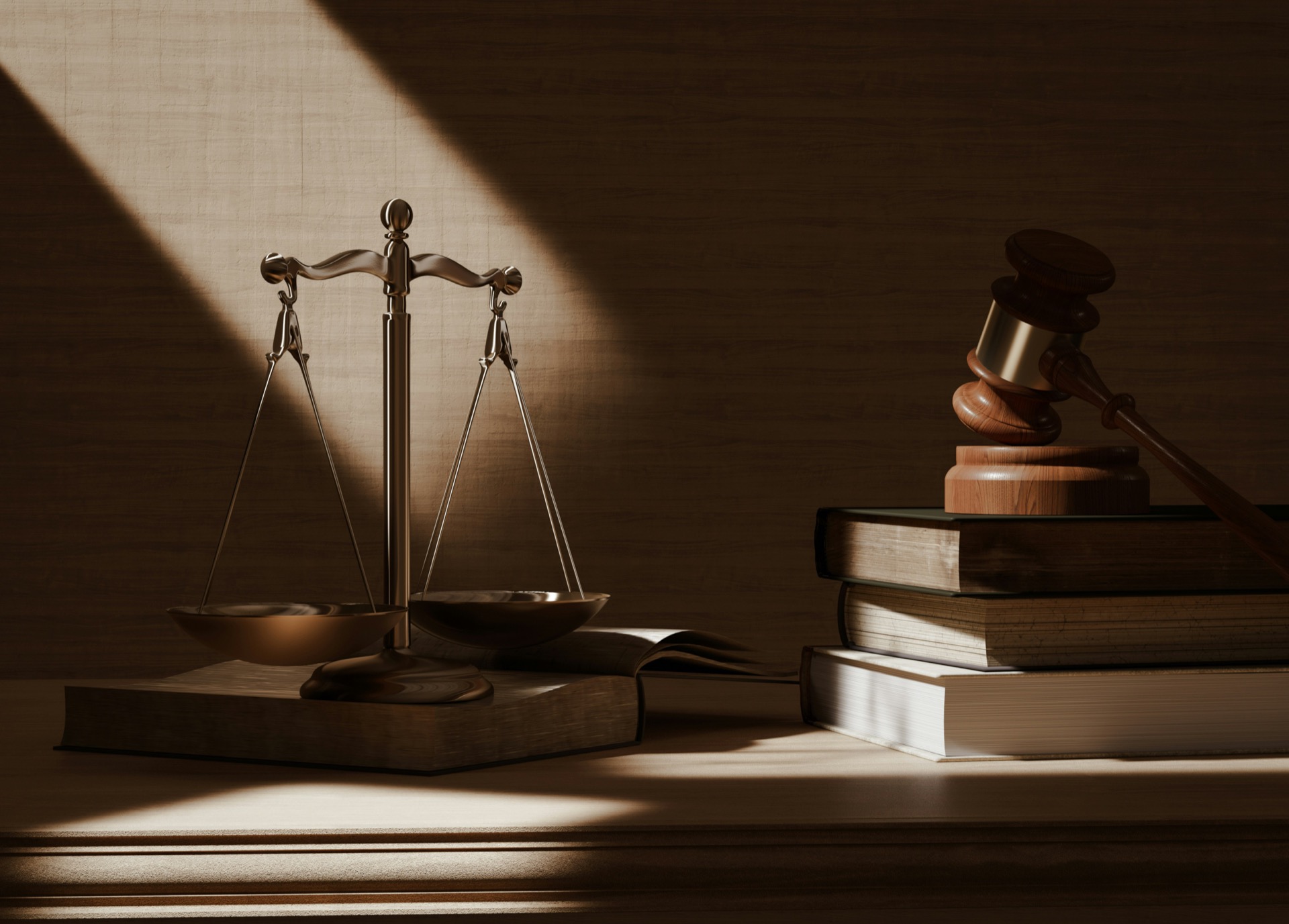 Scales and gavel in dramatic lighting