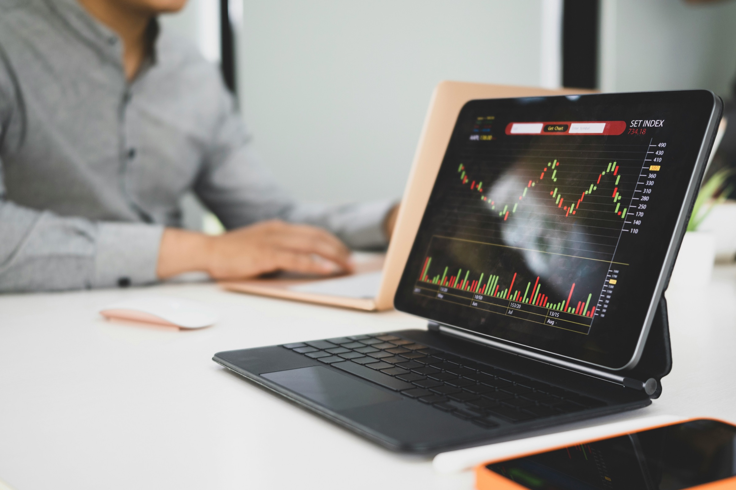 Senior advisor reviewing financial documents at desk