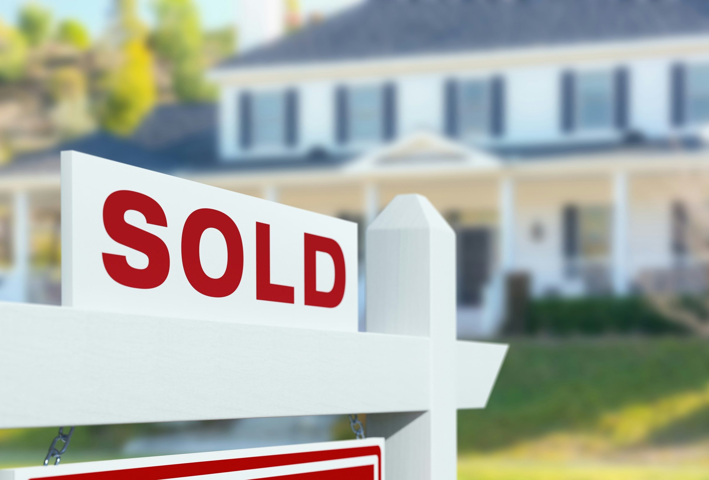 A sold sign in front of a Calder & Main listing