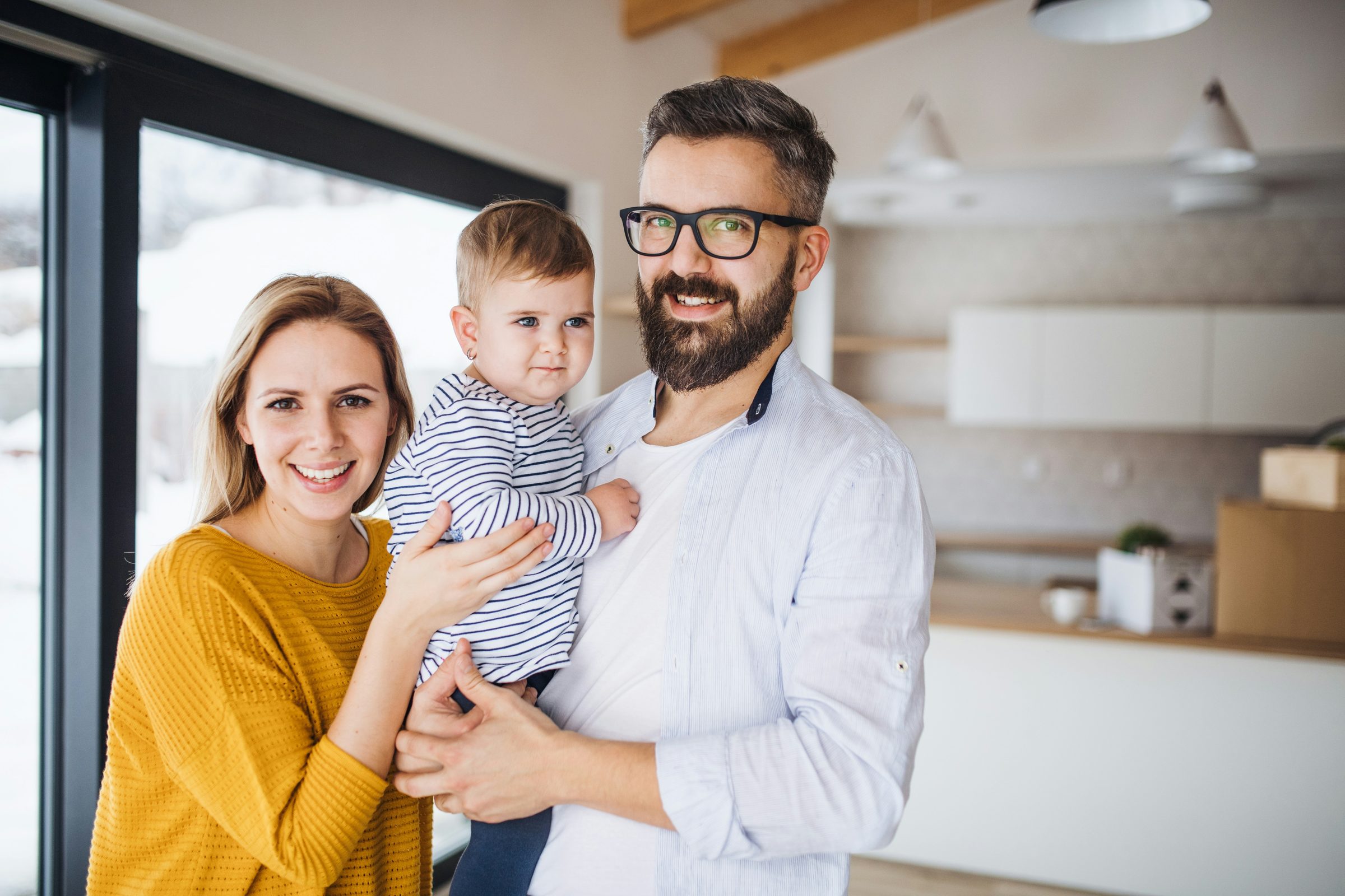 Ryan Carter with his kids outside their new home